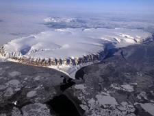 Saunders Island and Wolstenholme Fjord with Kap Atholl in the background seen during an IceBridge survey flight.