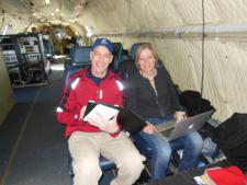 Teachers Mark Buesing and Jette Poulsen aboard the NASA P-3B during an IceBridge survey flight