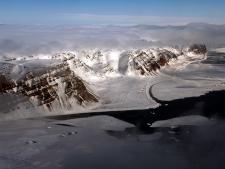 A view of mountains and sea ice near Thule Air Base, Greenland, from the NASA P-3 on May 6, 2014.