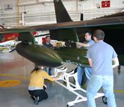 AJAX Team mounting pod onto Alpha Jet